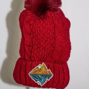 Red stocking cap with decorative patch and fuzzy lining